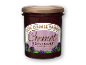 Cremet boysenbærmarmelade i et glas med guldlåg.