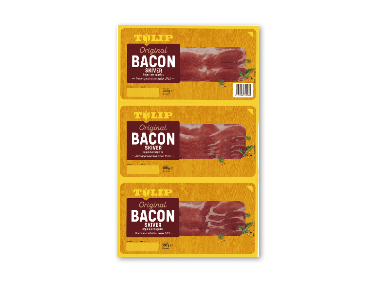 Tre pakker original røget bacon, 100 g hver, med teksten 'Baconspecialisten siden 1912'.
