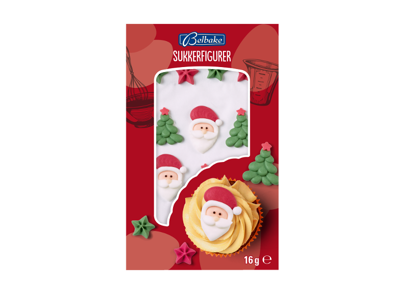 Julede sukkerfigurer med julemænd og grantræer, præsenteret på en cupcake.