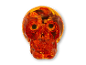 Orange gennemsigtigt Halloween-kranium fyldt med slik.
