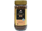 Glas instantkaffe med guldlåg og etiket med teksten 'GOLD MILD' og '100% ARABICA'.