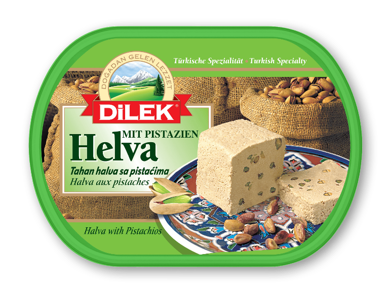 Halva med pistacienødder i en grøn plastbøtte