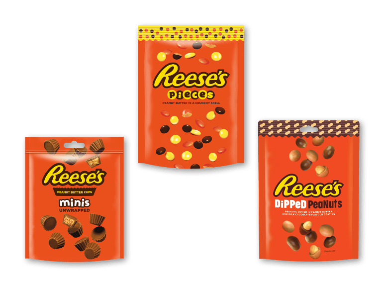 Tre forskellige orange poser med jordnøddesmør- og chokoladeslik.