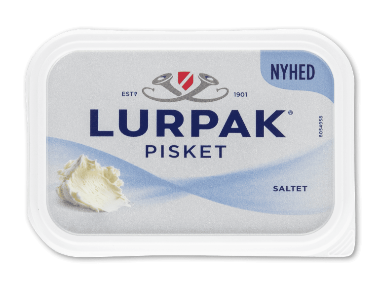 Pisket smørpakke med en smørklat, tekst 'NYHED PISKET SALET'