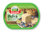 Halva med pistacienødder i en grøn plastbøtte