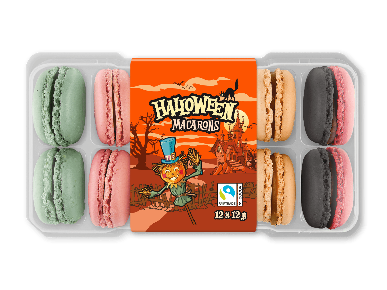 En pakke Halloween-macarons i grønne, lyserøde, orange og sorte farver.