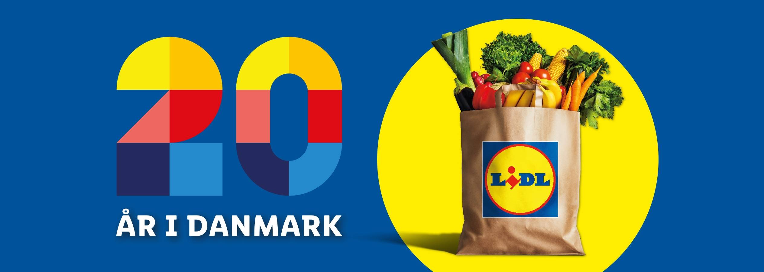 Lidl 20-års jubilæum i Danmark med indkøbspose fyldt med friske råvarer.