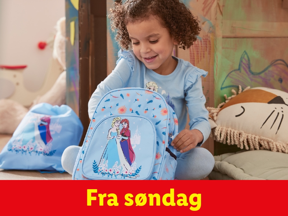 En lille pige med en ny Frozen rygsæk og taske fra søndag.