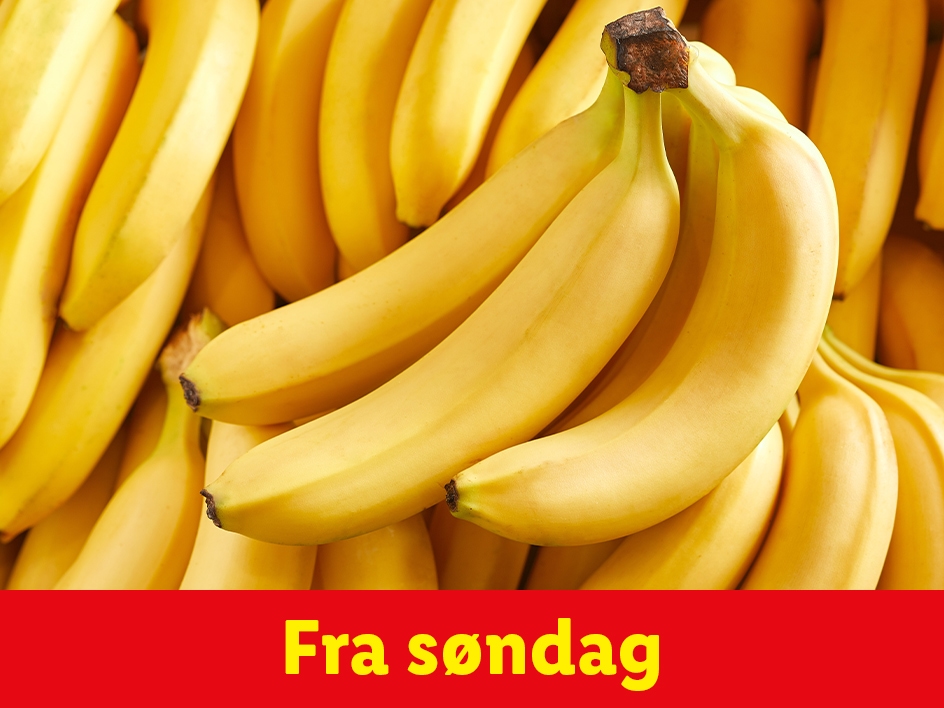En bunke modne gule bananer med teksten 'Fra søndag' på en rød baggrund.